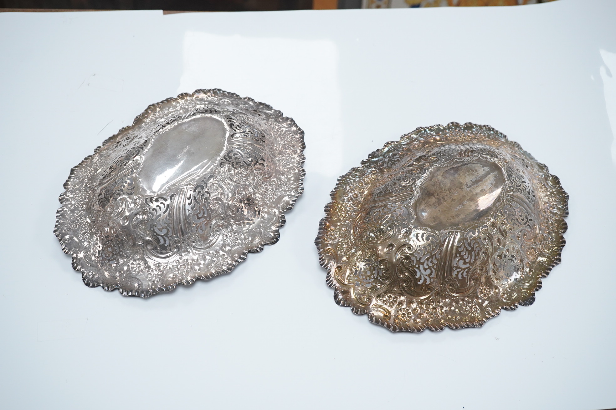 A pair of late Victorian pierced silver oval dishes, by Atkin Brothers, Sheffield, 1896, 27.9cm, 19.7oz. Condition - fair to good